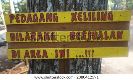 Wood sign in Dlingo Pine Forest