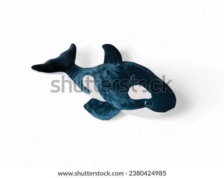 Stuffed orca whale on a white background