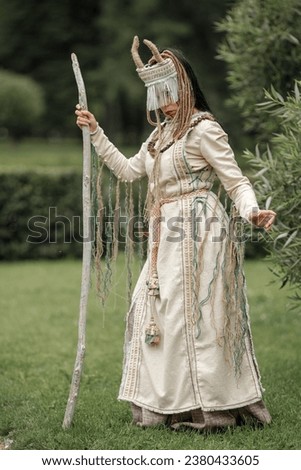 Beautiful girl in ethnic Karelian costume in nature.