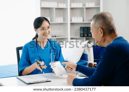 Healthcare costs and fees concept.Hand of smart doctor used a calculator and smartphone, tablet for medical costs at hospital in morning light


