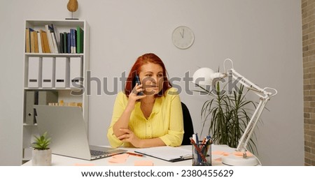 Happy business woman sharing firm success calling the investors. Easy technology access female calling her overseas client. Royalty-Free Stock Photo #2380455629