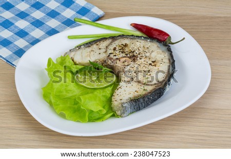 Grilled shark stesk with lime and salad leaves