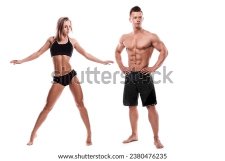 Muscular fitness couple against white background