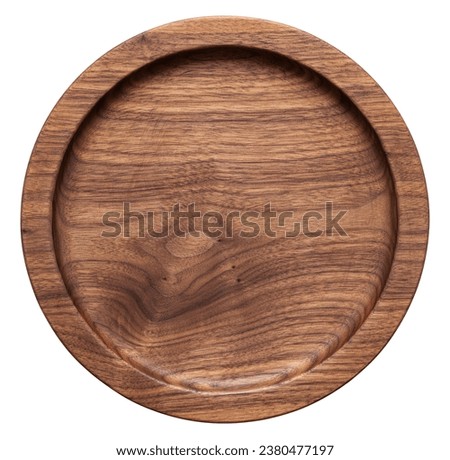 Wooden plate isolated on white background. Handmade walnut wood plate. Empty wooden plate on white background. 