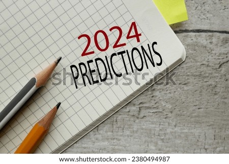 notebook open on a wooden table. words 2024 predictions Royalty-Free Stock Photo #2380494987