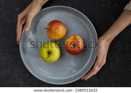 Autumn apple on the plate 