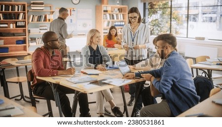 Diverse Multiethnic Young and Senior Adults Having a Fun Quiz Game Team Assignment, Undergoing a Workforce Training Program for Improving Connections and Relationships Between Employees Royalty-Free Stock Photo #2380531861
