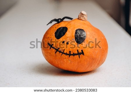orange pumpkin in sinister smiling face shape, halloween concept