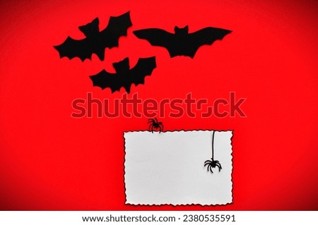 bars and spiders next to empty white card 