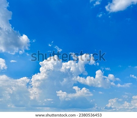 Background photography of blue sky and white clouds in summer. Bright beauty. In the quiet sunlight.