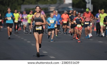 Happy female runner jog sport marathon. Smiling sportswoman work out public park. Woman athlete fast run long distance. Jogger fit body train. Girl sprint slow motion. City arena. Active life concept. Royalty-Free Stock Photo #2380551639