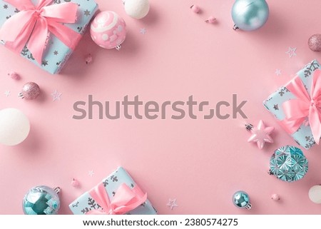 Stylish New Year concept. Top view photo of baubles, star shaped confetti, girly gift packages with ribbon bows, mistletoe berries on tender pastel pink background with space for text or advertisement