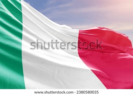 Italy national flag waving in beautiful sky.