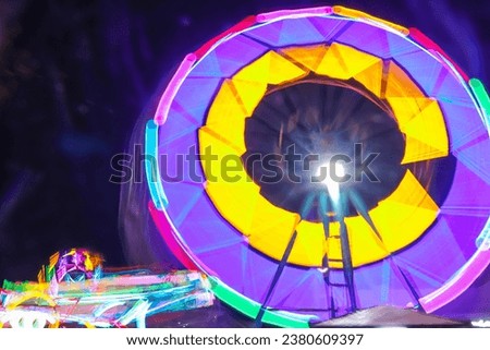 Image using a slow shutter speed of the ferris wheel