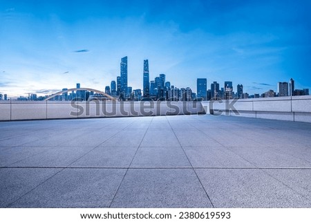 Square floor with city buildings skyline background in Guangzhou