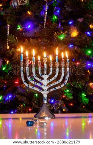 Background with Hanukkah menorah and burning candles for Jewish holiday Hanukkah.