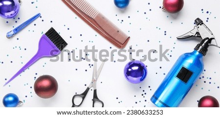 Hairdresser's supplies with Christmas balls on white background