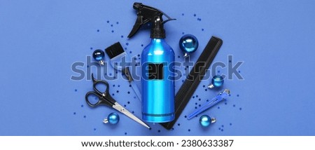 Hairdresser's supplies with Christmas decor on blue background