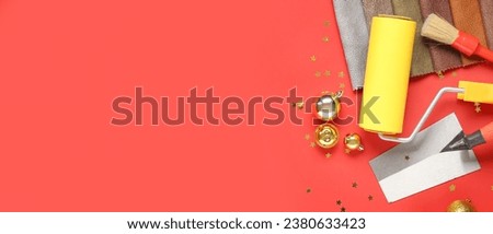 Painter's supplies with gifts and Christmas decor on red background with space for text