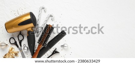 Hairdresser's tools with Christmas decor on white background with space for text