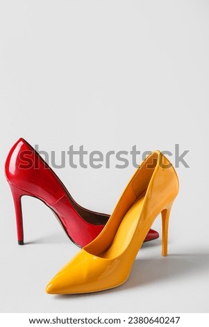 Different stylish high heels on white background