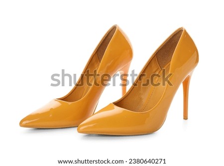 Stylish yellow high heels on white background Royalty-Free Stock Photo #2380640271