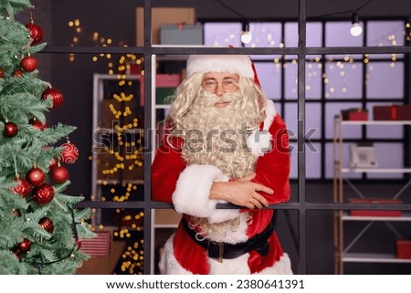 Santa Claus in post office with Christmas decorations