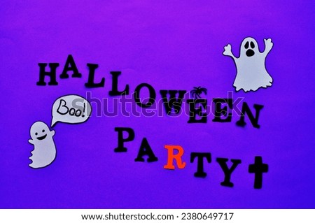 halloween party write with ghosts in dark blue background 