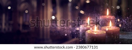 Advent Candles Burning In The Dark With Purple Glitter On Flames And Abstract Defocused Lights