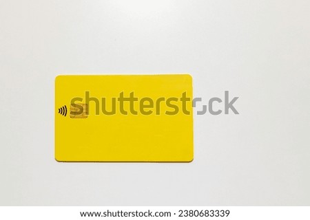 yellow bank card with a chip Royalty-Free Stock Photo #2380683339