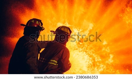 Fearless Firefighters Battling Blaze with Water and Extinguishers. Firefighters in Action, Extinguishing Fire with Teamwork and Courage. Intense Firefighting Training Exercise.