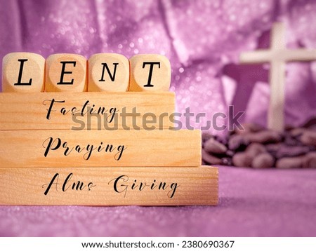 Lent Season,Holy Week and Good Friday concepts - Lent fasting praying alms giving text with purple background. Stock photo.
