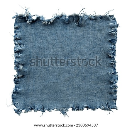 Piece of torn denim on a white background. Denim texture Royalty-Free Stock Photo #2380694537