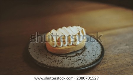 Lemon meringue pie, Lemon cheesecake, Lemon tart cake. Lemon tart with whipped cream and mint sweet dessert on plate