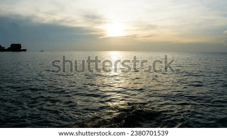 Meditation ocean and sky background. Gold sky and ocean water. Waves splashes. Sunset over sea with golden dramatic sky panorama. Calm sea with sunset. Ocean and sky background.