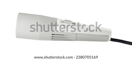 Old microphone with a black wire. Isolated on a white background 
