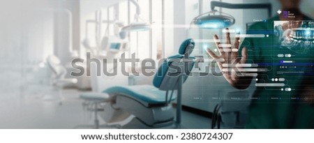 Dentist interacting with patient, use VR computer filling out charts schedule management for treatment with Ai technology for innovate different treatments,dental practices specifically. Royalty-Free Stock Photo #2380724307