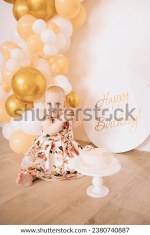 The baby is 1 year old. Baby's birthday. Children's holiday. First birthday. Baby crawling