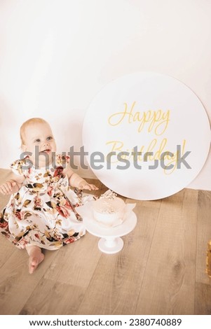 The baby is 1 year old. Baby's birthday. Children's holiday. First birthday. Baby crawling