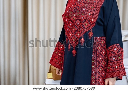 A Palestinian woman dress in red and black Royalty-Free Stock Photo #2380757599