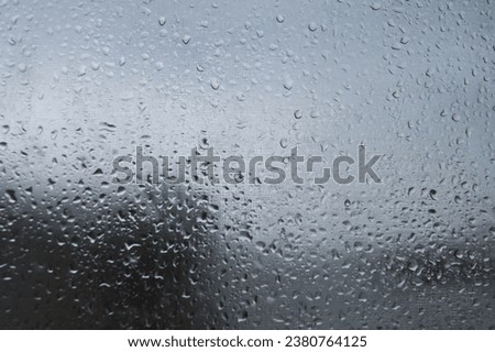 rainy day wet window with drops sad Royalty-Free Stock Photo #2380764125