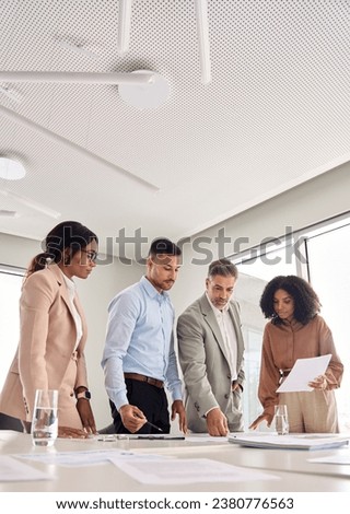 Diverse executive business team people group working with paperwork standing at table, analyzing corporate strategy, reviewing plan managing financial project overview at office meeting, vertical. Royalty-Free Stock Photo #2380776563