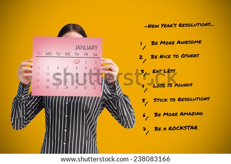 Businesswoman showing a calendar in front of her face against pink card