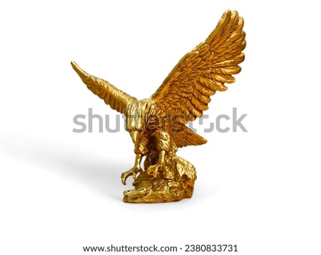miniature statue of a gold eagle on a white background