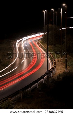 Road at night with light trails from cars in Almeria