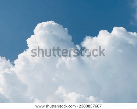 Blue sky with clouds. Sky replacement, Ornamental clouds. Dramatic sky. Epic storm cloudscape. Soft sunlight. Panoramic image, texture, background, graphic resources, design, copy space. Meteorology