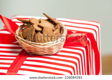 Shaped Gingerbread Cookies placed on Christmas gift box