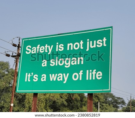 Safety is not just a slogan it's a way of line sign board on the road side. 