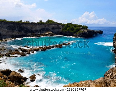Beautiful beach with blue water and blue sky color