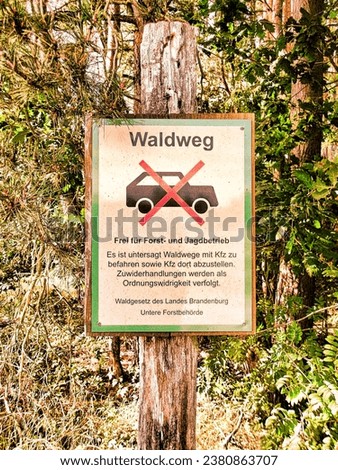 Prohibition sign with the inscription - Driving on the forest path is prohibited - Free for forestry and hunting